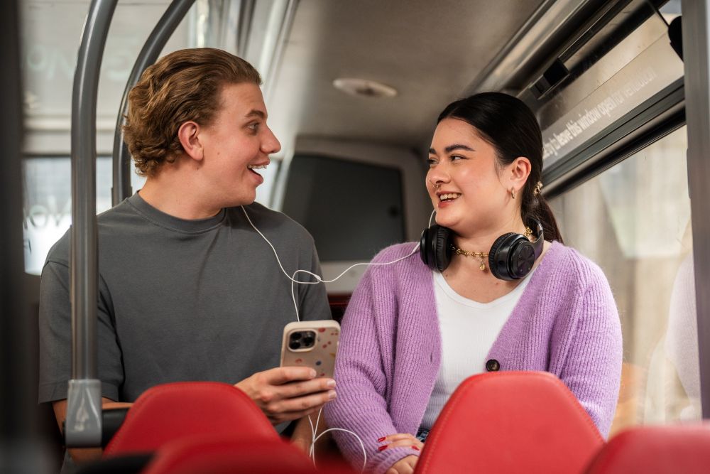 Young people chatting on a bus